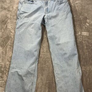 Hollister low rise baggy woman’s jeans size 14R light blue wash raw edge